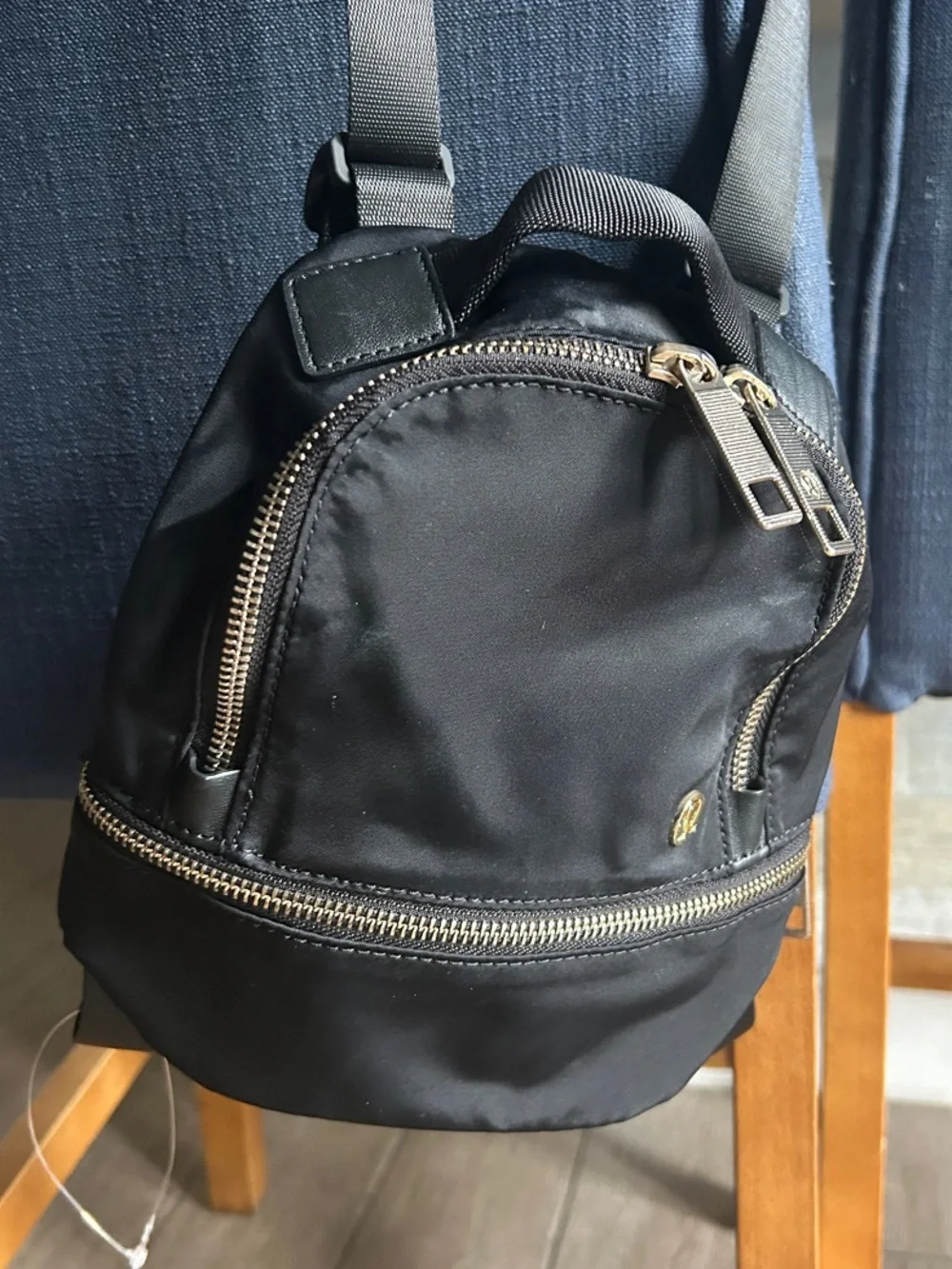 Lululemon City Adventurer Backpack Micro 3L in Black with Gold hardware.